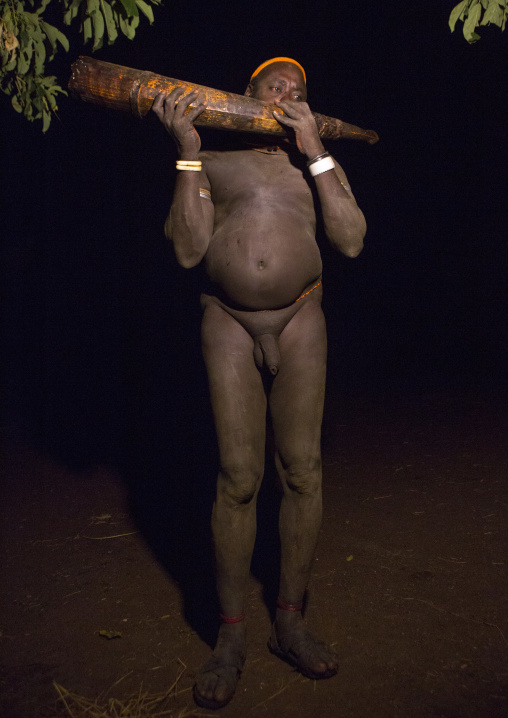 Bodi Tribe Man Blowing In An Elephant Tusk During The Kael Ceremony, Hana Mursi, Omo Valley, Ethiopia