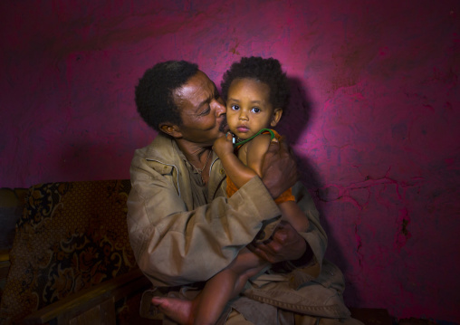 Father and her daughte rin a bar, Jinka, Omo valley, Ethiopia