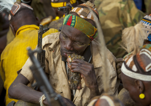 Dassanech Tribe Warriors Sharing Cow Meat During A Ceremony, Omorate, Omo Valley, Ethiopia