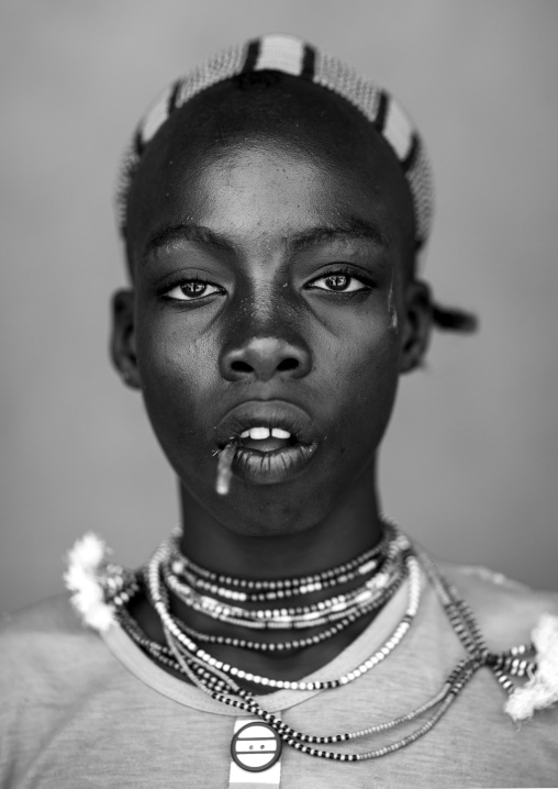 Hamer Young Man With A Stick In His Mouth, Dimeka, Omo Valley, Ethiopia