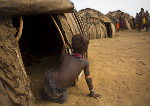 Dassanech Tribe Boy Standing In Front Of His House, Omorate, Omo Valley, Ethiopia