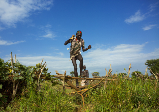 Bashada Tribe Man Jumping A Fence, Dimeka, Omo Valley, Ethiopia