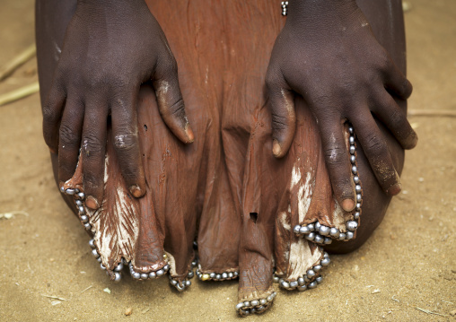 Kneeled Karo Woman With Skin Loincloth And Hand On Her Legs Ethiopia