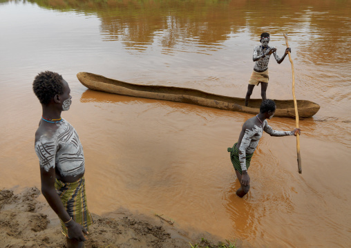 Karo White Painted Chest Karo Men One In A Pirogue On Omo River Holding Pole Ethiopia