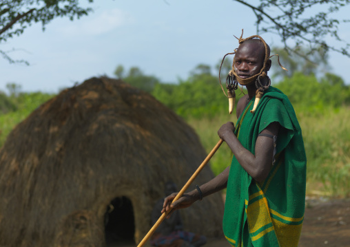 Mursi Man Standing In Front Of Hut Ethiopia