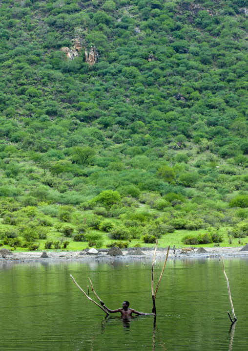 Borana Tribe Man Diving To Pick Up Salt From The Lake Of El Sod Volcano, Yabello, Omo Valley, Ethiopia