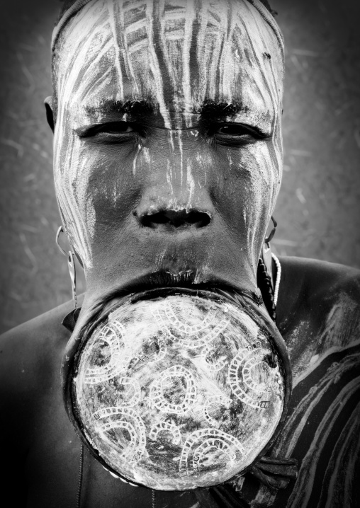 Black And White Portrait Of A Mursi Tribe Woman With Lip Plate And Enlarged Ears In Mago National Park, Omo Valley, Ethiopia