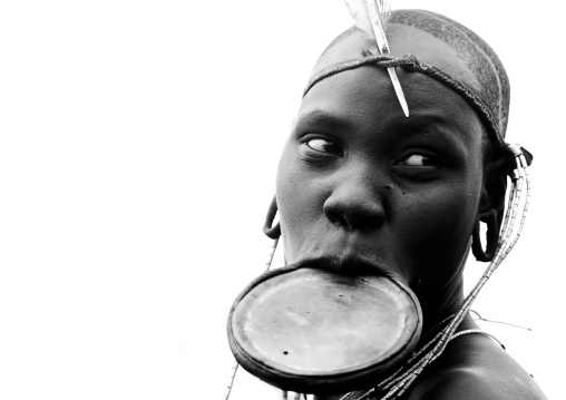 Black And White Portrait Of A Mursi Tribe Woman With Lip Plate And Enlarged Ears In Mago National Park, Omo Valley, Ethiopia