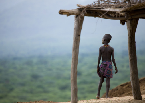 Rear View Of Karo Tribe Boy Over The Omo River, Korcho, Ethiopia