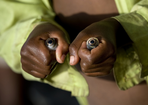 Kid with the fresh fish eyes he just pulled out, Zway lake, Ethiopia