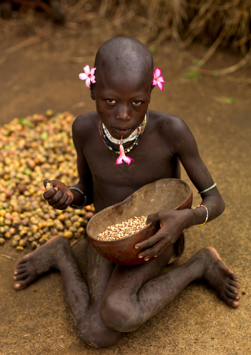 Portrait Of A Karo Tribe Kid With Flowers As Earrings, Korcho Village, Omo Valley, Ethiopia