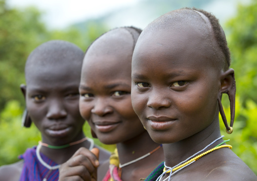 Suri tribe women with enlarged earlobe, Kibish, Ethiopia