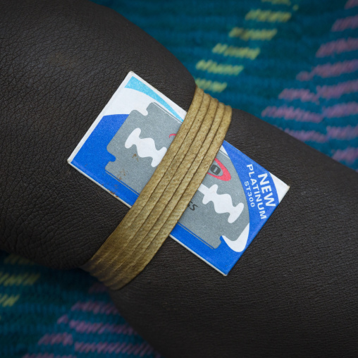 Razor blade used for hair and scarifications on a Suri woman, Kibish, Omo valley, Ethiopia