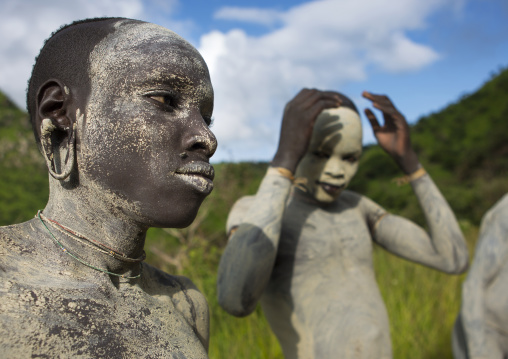 Suri tribe shephers with body paintings as camouflage, Tulgit, Omo valley, Ethiopia