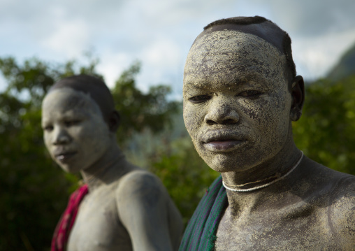 Suri tribe shephers with body paintings as camouflage, Tulgit, Omo valley, Ethiopia