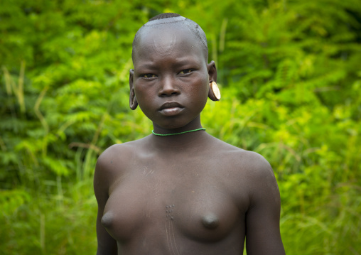 Suri tribe woman ready for a scarification ceremony, Tulgit, Omo valley, Ethiopia