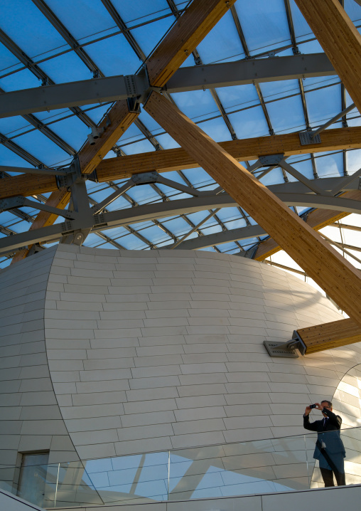 Visitor Taking Picture In Louis Vuitton Foundation, Bois De Boulogne, Paris, France