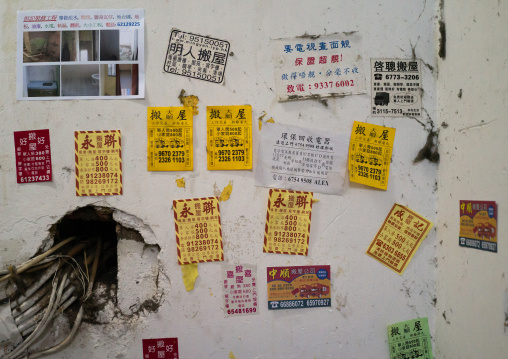 Advertisements on street walls for moving home, Special Administrative Region of the People's Republic of China , Hong Kong, China