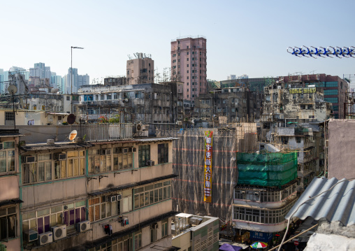 Facades of old apartments towesr in a very crowded district, Special Administrative Region of the People's Republic of China , Hong Kong, China