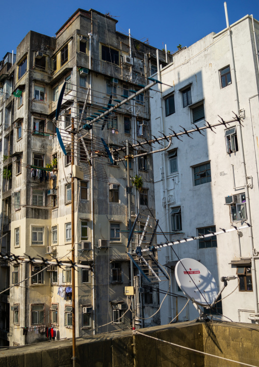 Facades of old apartments towesr in a very crowded district, Special Administrative Region of the People's Republic of China , Hong Kong, China