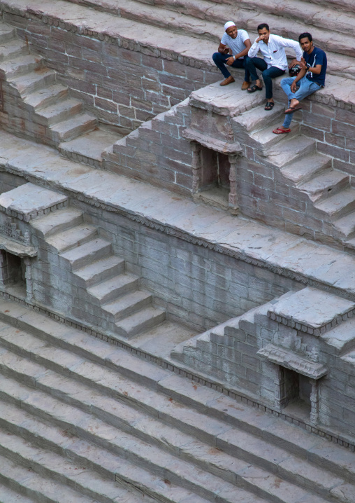 Indian men in toorji ka Jhalra stepwell, Rajasthan, Jodhpur, India