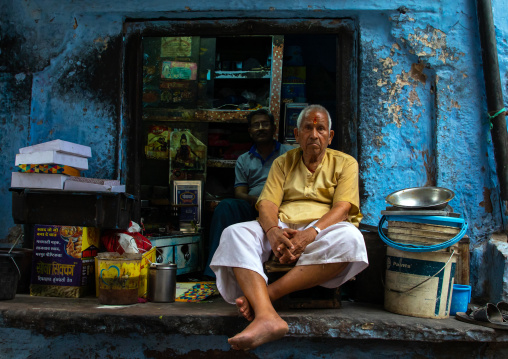 Indian man in front of his shop in the street, Rajasthan, Jodhpur, India