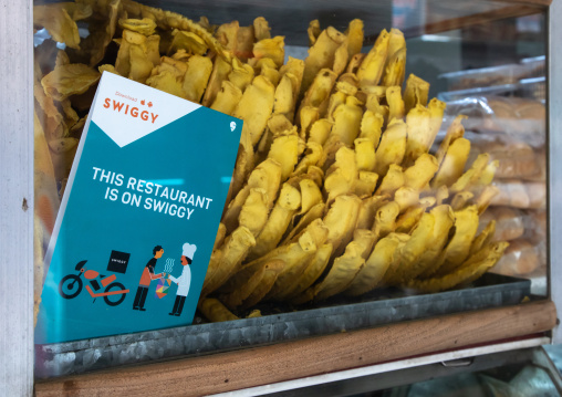 Swiggy food delivery adverstising in a restaurant, Rajasthan, Bikaner, India