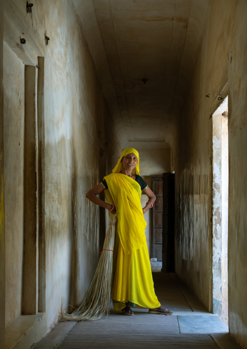 Portrait of a rajasthani woman in traditional yellow sari in nahargarh fort, Rajasthan, Amer, India