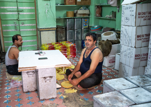 Indian men packing papadum, Rajasthan, Bikaner, India