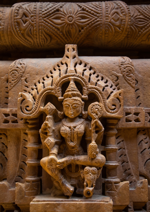 Golden coloured sandstone statues inside the jain temple, Rajasthan, Jaisalmer, India