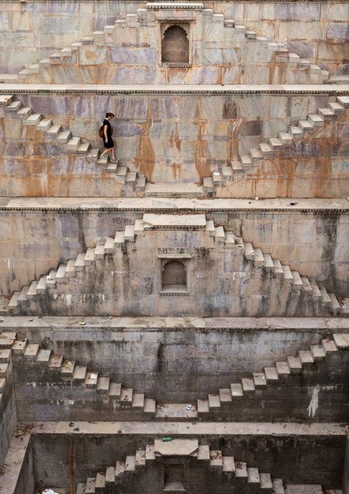 Western tourist in Nagar sagar Kund stepwell, Rajasthan, Bundi, India