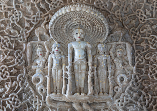 Carved idol made of white marble on the wall of Tirthankar jain temple, Rajasthan, Ranakpur, India