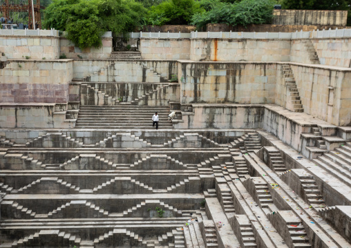 Indian man with his goat in dhabhai ka Kund stepwell, Rajasthan, Bundi, India