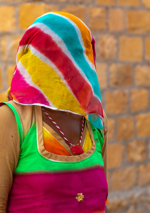 Portrait of a rajasthani woman hidding her face under a sari, Rajasthan, Jaisalmer, India