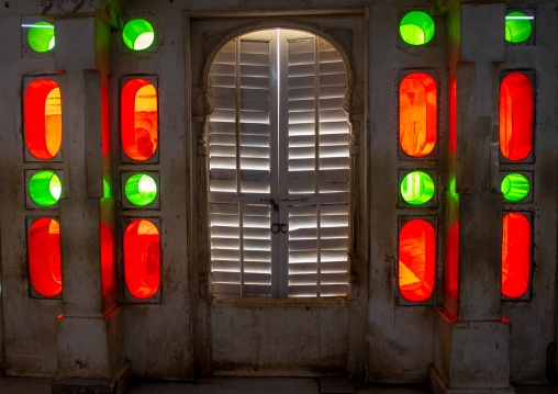 Multi coloured stained glass windows in the city palace, Rajasthan, Udaipur, India