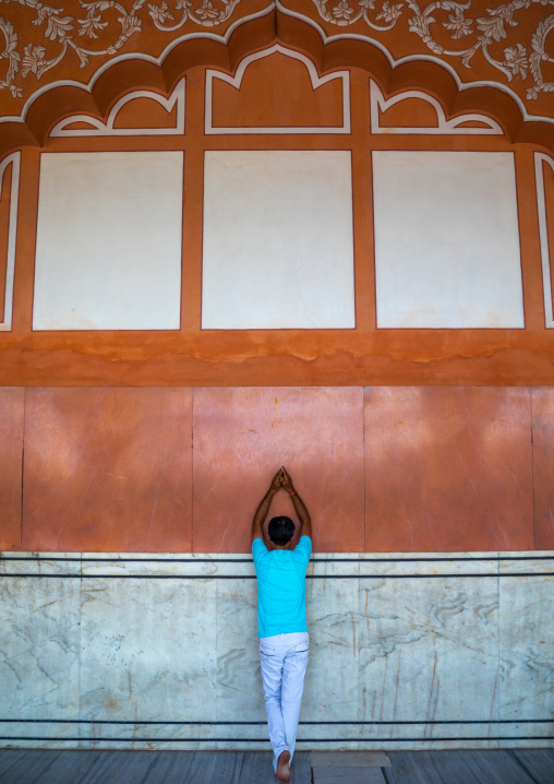 Indian man praying in a temple, Rajasthan, Jaipur, India