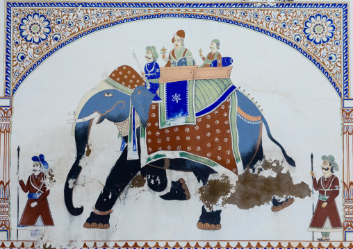 Wall paintings depicting indian people on an elephant on an old haveli, Rajasthan, Nawalgarh, India