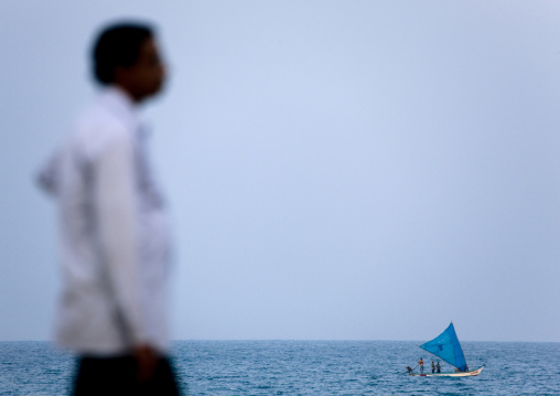 Man At The Seaside While Fishermen Are Sailing On The Sea, Pondicherry, India