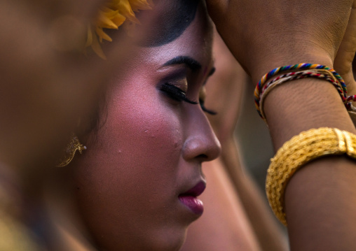 A Teenager Girl In Traditional  Costume Praying Before A Tooth Filing Ceremony