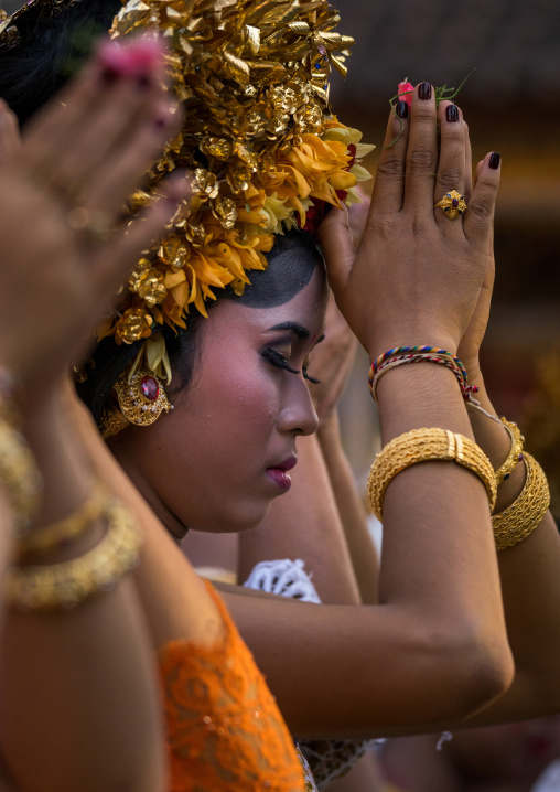 A Teenager Girl In Traditional  Costume Praying Before A Tooth Filing Ceremony