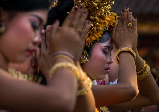 A Teenager Girl In Traditional  Costume Praying Before A Tooth Filing Ceremony