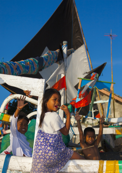 Kids Playing On A Prahu Boat, Mataram, Lombok Island, Indonesia