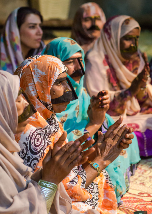 women with traditional burqas masks during a zar ceremony, Qeshm Island, Salakh, Iran