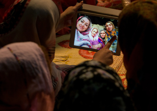 iranian women taking selfie picture with a tablet, Qeshm Island, Salakh, Iran