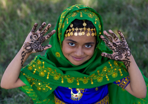 little girl with henna painted hands, Hormozgan, Bandar-e Kong, Iran