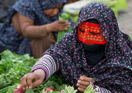 a bandari woman wearing a traditional mask called the burqa at panjshambe bazar thursday market, Hormozgan, Minab, Iran