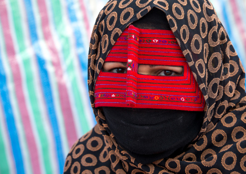 a bandari woman wearing a traditional mask called the burqa at panjshambe bazar thursday market, Hormozgan, Minab, Iran