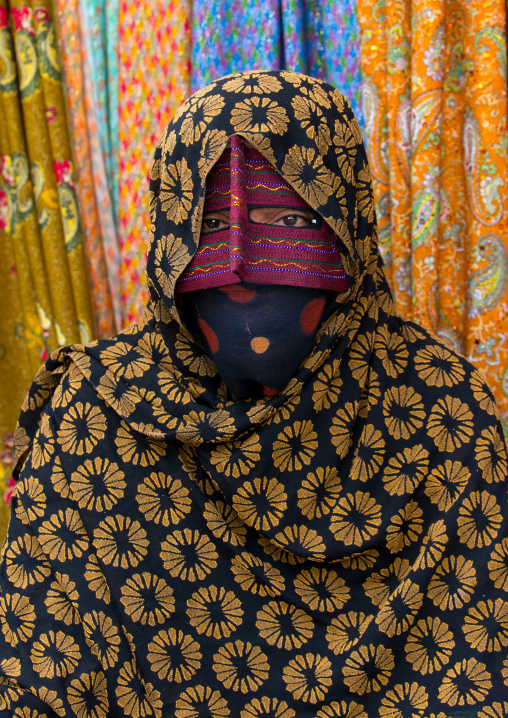 a bandari woman wearing a traditional mask called the burqa at panjshambe bazar thursday market, Hormozgan, Minab, Iran