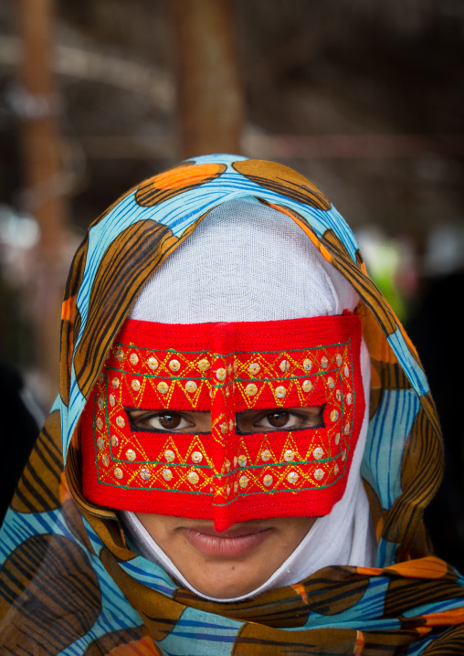 a bandari woman wearing a traditional mask called the burqa at panjshambe bazar thursday market, Hormozgan, Minab, Iran