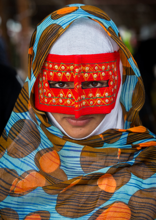 a bandari woman wearing a traditional mask called the burqa at panjshambe bazar thursday market, Hormozgan, Minab, Iran